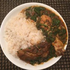 A picture of Rice with vegetable sauce.