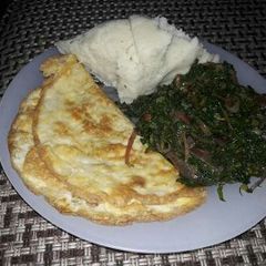 Omelette, sauted kales with Ugali A picture of Omelette, sauted kales with Ugali.