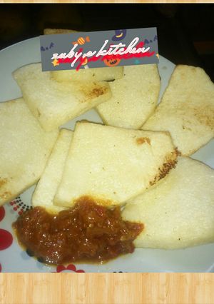A picture of Fried yam with stew.