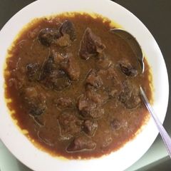 A picture of Pitted plum and beef/lamb stew.