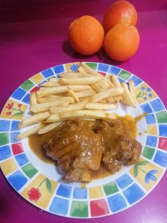 Una foto de Manitas de cerdo en salsa