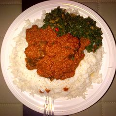 A picture of Stew and vegetable sauce with rice.