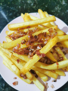 Una foto de Papas fritas con panceta