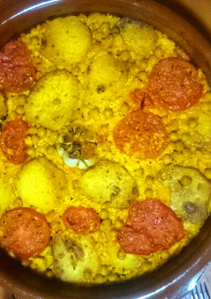 Una foto de Arroz al horno de bacalao inglés y pasas