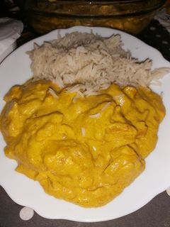 Una foto de Pollo al curry con cebolla