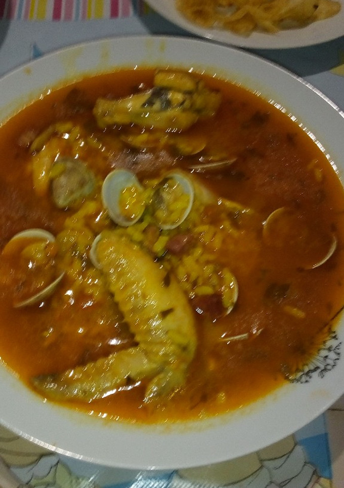 Una foto de Arroz con chirlas y pollo