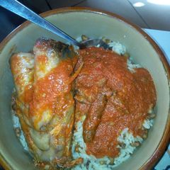 A picture of Catfish stew with rice and beans.
