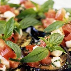 Spanish Grilled Aubergine with tomato vinaigrette A picture of Spanish Grilled Aubergine with tomato vinaigrette.