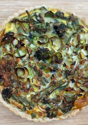 A picture of Quiche with smoked mozzarella and purple sprouting broccoli.