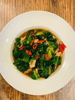 A picture of Spring green and pork stir-fry.