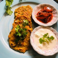A picture of Barely veggie pancake or Thalipith.