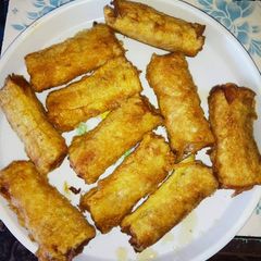 A picture of Sausage wrapped in bread.