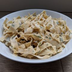 A picture of Pasta with parsley.