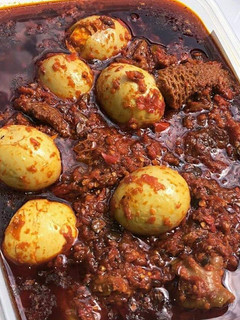 A picture of Ofada Stew/ palm oil stew.