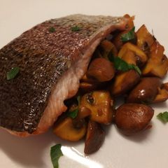 A picture of Oven roasted rainbow trout with saffron mushrooms.