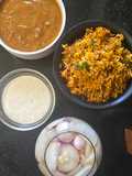 Biryani dal makhani raita platter