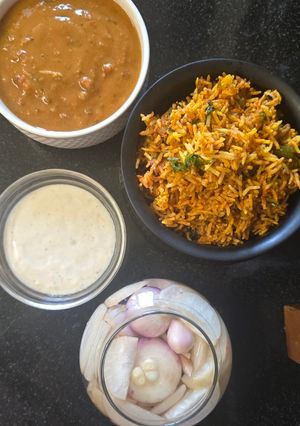 A picture of Biryani dal makhani raita platter.