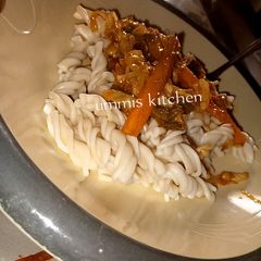A picture of Macaroni with vegetable soup.