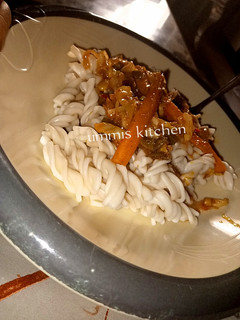 A picture of Macaroni with vegetable soup.