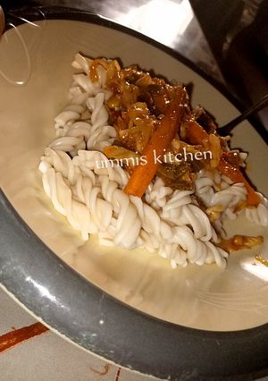 A picture of Macaroni with vegetable soup.