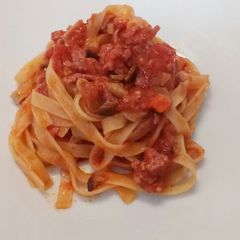 A picture of Tagliatelle with mushroom and salame ragù.