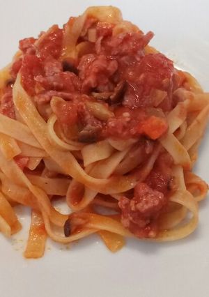 A picture of Tagliatelle with mushroom and salame ragù.
