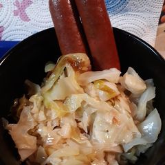 A picture of Salted Fried Cabbage and Steamdogs.