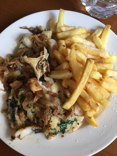 Una foto de Merluza encebollada