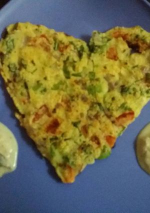 A picture of Suji palak ka dil (Uttapam).
