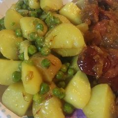 A picture of Saffron Flowers with English Peas and Potatoes.