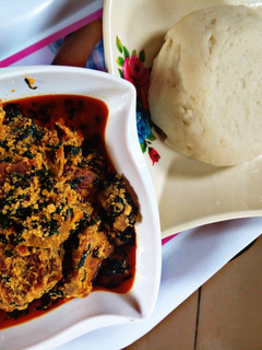 A picture of Pounded yam with Equsi soup.