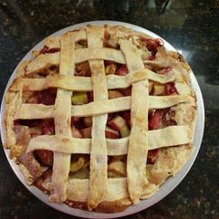 A picture of Strawberry rhubarb custard pie.