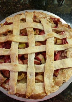 A picture of Strawberry rhubarb custard pie.