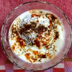 A picture of Dahi vada (lental dumpling) is a popular India chaat.