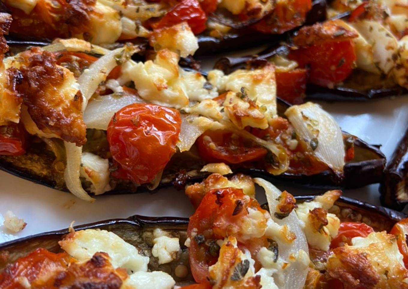 Baby Aubergines with baby plum tomatoes, onion and feta