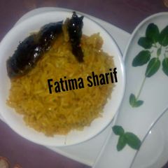 Jallof rice with smoke fish A picture of Jallof rice with smoke fish.