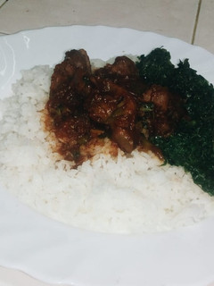 A picture of Gizzard with rice and greens.