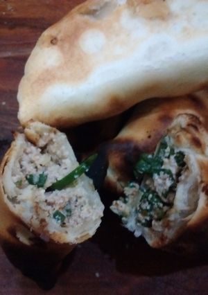 Una foto de Empanadas de ricota y verdeo al parrigas