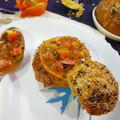 Pretzel bread buns filled tomato kootu A picture of Pretzel bread buns filled tomato kootu.