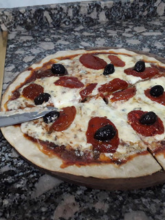 Una foto de Pizza de masa madre