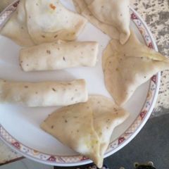 A picture of Homemade Samosay and roll.