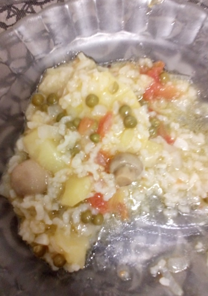 Una foto de Guiso de patatas con arroz a mi manera