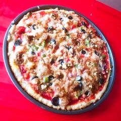 A picture of Beef Tikka pizza.
