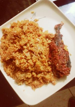 A picture of Spicy jollof rice & peppered fish.