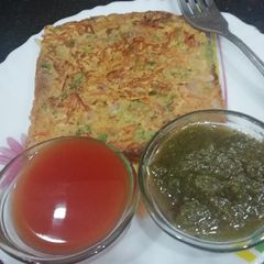 A picture of Besan bread on griddle.