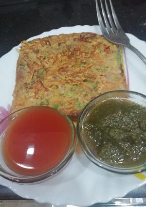 A picture of Besan bread on griddle.