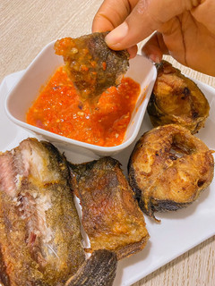 A picture of Fried catfish and pepper sauce.