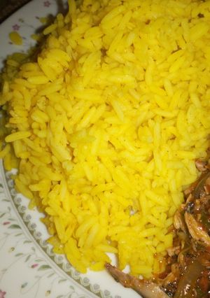 A picture of Curry rice and ugu stew.