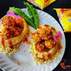 A picture of Maggi peanut cracker in potato boat.