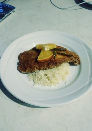 A picture of Fried cajun mangove snapper with citrus garlic butter rice.